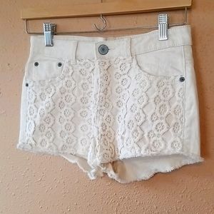 Cream high rise denim lace front shorts